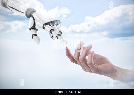 Hand of man pretending to hold an invisible object against sky Stock Photo
