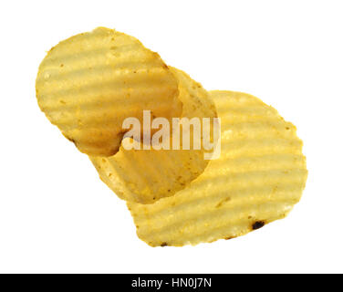 Top view of three wavy potato chips isolated on a white background. Stock Photo