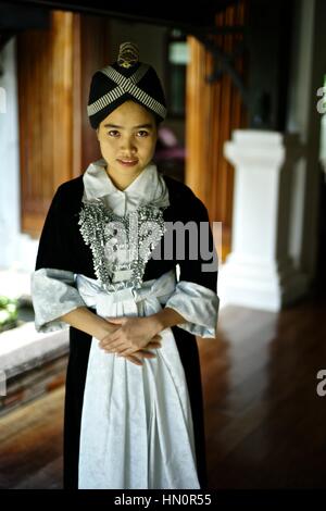 Young girl wearing a Hmong Kao traditional dress in Laos. Name: Anna Saksena Stock Photo