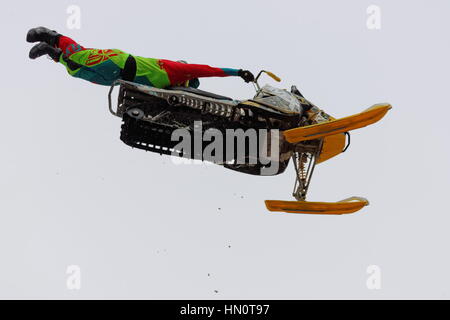 World snowmobiling champions perform aerial tricks in downtown Montreal. Stock Photo