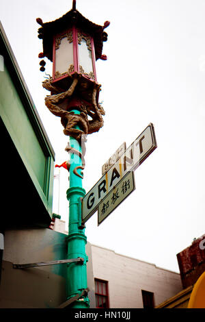 Chinese lantern and street sign in English and Chinese Stock Photo