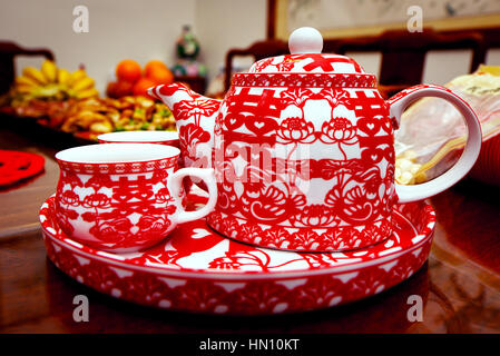 Traditional Chinese wedding tea pot and set in red Stock Photo