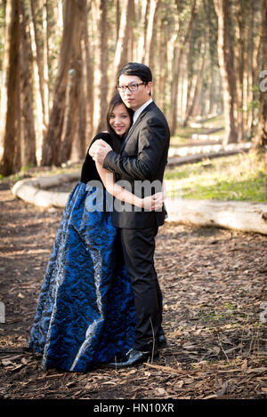 Couple posing in the forest for engagment photo Stock Photo