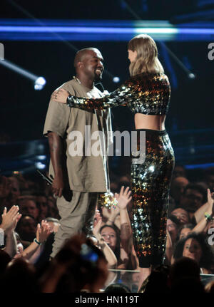 Rapper Kanye West and Taylor Swift hug at the MTV Video Music Awards on August 30, 2015 in Los Angeles. Photo by Francis Specker Stock Photo