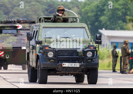BURG / GERMANY - JUNE 25, 2016: german light armoured patrol vehicle Enok, drives on open day in barrack burg / germany at june 25, 2016 Stock Photo