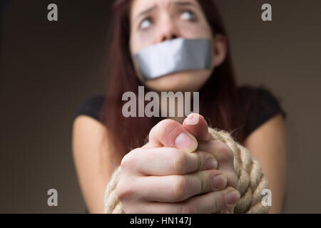 Female Hostage With Tied Hands On Dark Background Closeup Stock Photo Alamy