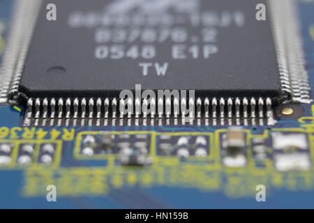 Close up of printed circuit board with big microchip and other components Stock Photo