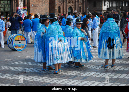 Peruvian locals dressed up in traditional dress taking part in the procession at a Religious festival, Plaza de Armas, Cusco, Peru Stock Photo
