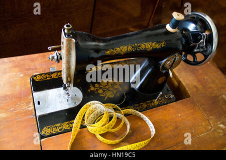 Singer sewing machine, old background Stock Photo