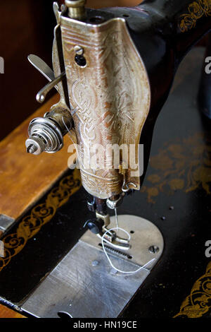 Singer sewing machine, old background Stock Photo