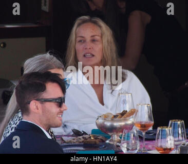 Sharon Stone eats lunch in her bathrobe and no make-up on the Roberto Cavalli yacht in the harbor at the 66th Cannes Film Festival in Cannes, France on May 21, 2013. Photo by Francis Specker Stock Photo