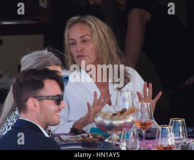 Sharon Stone eats lunch in her bathrobe and no make-up on the Roberto Cavalli yacht in the harbor at the 66th Cannes Film Festival in Cannes, France on May 21, 2013. Photo by Francis Specker Stock Photo