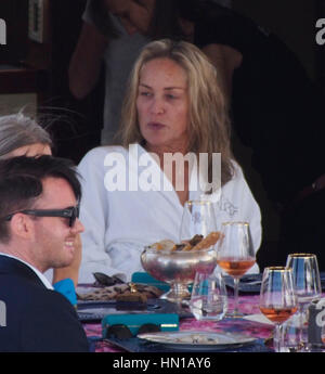 Sharon Stone eats lunch in her bathrobe and no make-up on the Roberto Cavalli yacht in the harbor at the 66th Cannes Film Festival in Cannes, France on May 21, 2013. Photo by Francis Specker Stock Photo