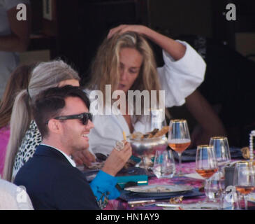 Sharon Stone eats lunch in her bathrobe and no make-up on the Roberto Cavalli yacht in the harbor at the 66th Cannes Film Festival in Cannes, France on May 21, 2013. Photo by Francis Specker Stock Photo