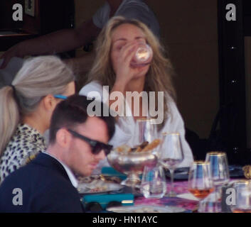 Sharon Stone eats lunch in her bathrobe and no make-up on the Roberto Cavalli yacht in the harbor at the 66th Cannes Film Festival in Cannes, France on May 21, 2013. Photo by Francis Specker Stock Photo