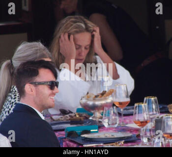 Sharon Stone eats lunch in her bathrobe and no make-up on the Roberto Cavalli yacht in the harbor at the 66th Cannes Film Festival in Cannes, France on May 21, 2013. Photo by Francis Specker Stock Photo