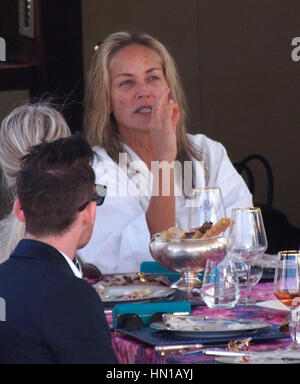 Sharon Stone eats lunch in her bathrobe and no make-up on the Roberto Cavalli yacht in the harbor at the 66th Cannes Film Festival in Cannes, France on May 21, 2013. Photo by Francis Specker Stock Photo