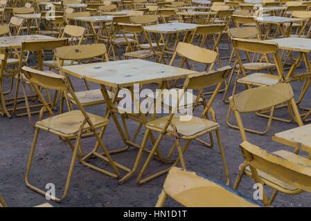 Many yellow metal folding tables and chairs. Kompong Cham, Cambodia Stock Photo