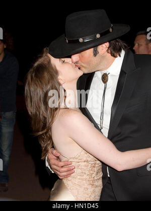 Director Robert Rodriguez kisses girlfriend Marci Madison on the Croisette at the 65th Cannes Film Festival in Cannes, France on May 19, 2012. Photo by Francis Specker Stock Photo