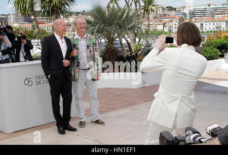 Bruce Willis, left, and Bill Murray have their photo taken by Director Wes Anderson at the photo call for the film, 'Moonrise Kingdom' during the 65th Cannes Film Festival in Cannes, France on May 16, 2012. Photo by Francis Specker Stock Photo