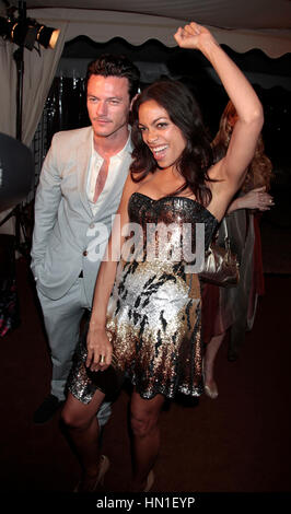 Luke Evans and Rosario Dawson leave the Roberto Cavalli party in Cannes, France on May 18, 2011. Photo by Francis Specker Stock Photo