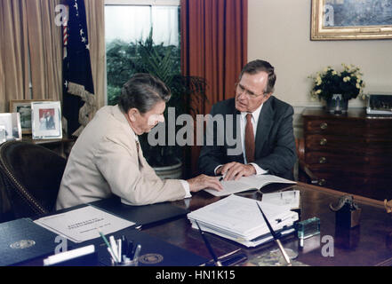 PRESIDENT RONALD REAGAN at left with Vice President H.W.Bush in the Oval Office of the White House on 20 July 1984. Photo: White House Official Stock Photo