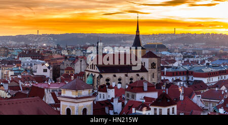 Amazing sunset and sky and fantastic view of the Old town square and Prague castle at dawn. Dramatic scene. Stock Photo