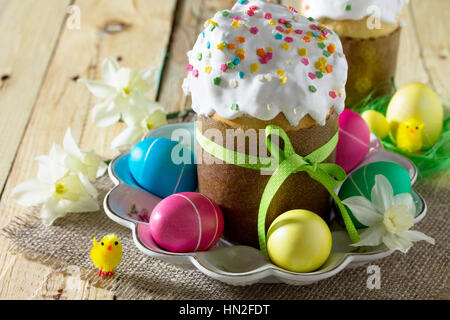 Easter background. Traditional food on the holiday table home cooking - breads and painted eggs. Easter recipe. Stock Photo