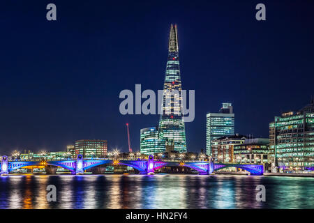 View of the river Thames towards Southwark Bridge and the Shard at night.