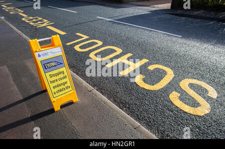 Stopping here could endanger a child's life signs Stock Photo