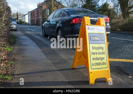 Stopping here could endanger a child's life signs Stock Photo