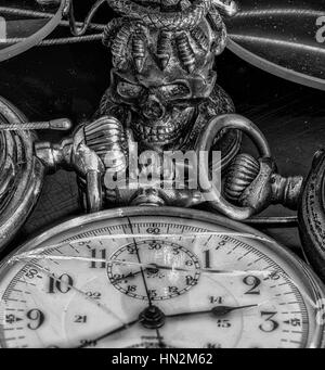 Still life monochrome macro of ancient historic old pocket watches, symbolic decay, fading,time,past,aging,age,carpe diem Stock Photo