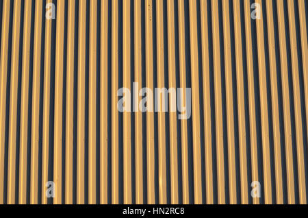 light brown corrigated steel plate building wall background Stock Photo