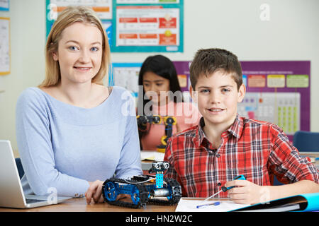 Teacher With Pupils In Science Lesson Studying Robotics Stock Photo