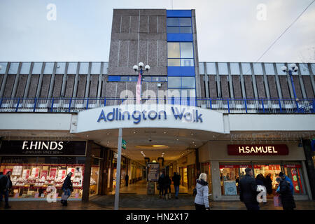 Dull winter day showing the 1960's  exterior of Adlington Walk part of the shopping precinct at Stockport Town Centre in Cheshire, England, UK. Stock Photo