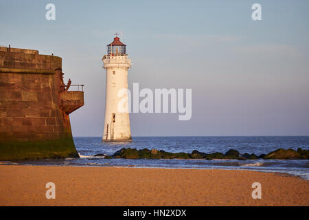 Liverpool bay sunrise at New Brighton Fort Perch Rock and Lighthouse Marine Promenade in Wallasey, Merseyside, Wirral, England, UK. Stock Photo