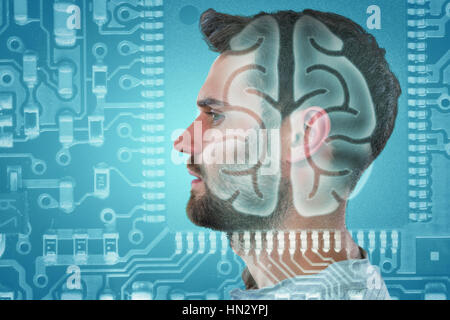 Profile of a handsome man against human brain in circuit board Stock Photo