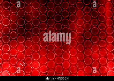 Plastic polymer bubble wrap in high contrast vivid red scarlet color Stock Photo