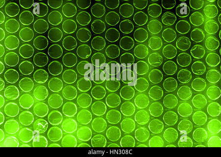 Plastic polymer bubble wrap in high contrast vivid olive green color Stock Photo