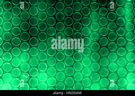 Plastic polymer bubble wrap in high contrast vivid bluish green color Stock Photo