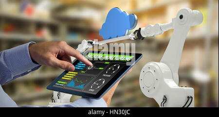 Man using tablet pc against workshop Stock Photo