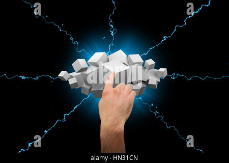 Hand pointing against grey cubes floating in a cluster Stock Photo