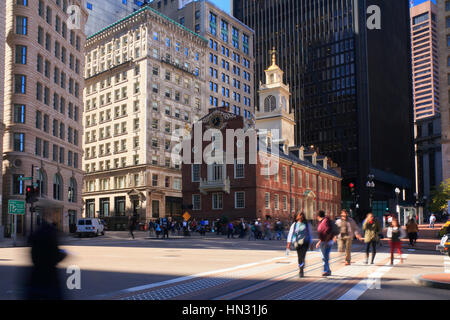 Old State House, now history museum and people crossing at busy intersection in downtown Boston, Massachusetts, United States Stock Photo