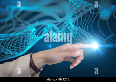 Businesswoman using imaginative digital screen against abstract glowing background Stock Photo