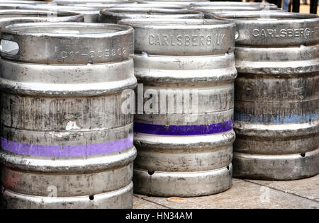 Aluminium beer real ale,lager kegs (barrels) stacked on the pavement in the city of leeds uk after a brewery delivery to a pub Stock Photo