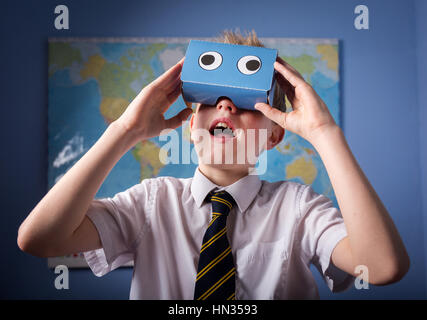 A School Pupil exploring the world through a VR Virtual Reality headset Stock Photo