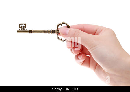 Hand holding antique key isolated on white background Stock Photo - Alamy