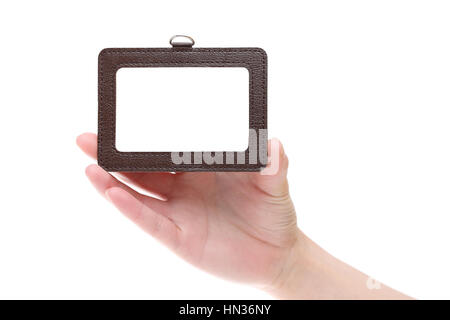 Hand holding blank identification badge isolated on white background Stock Photo