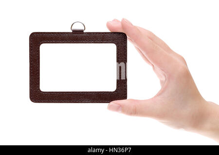 Hand holding blank identification badge isolated on white background Stock Photo