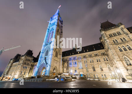 Winter holiday light show projected at night on the Canadian House of Parliament to celebrate the 150th Anniversary of Canada in Ottawa, Canada. Stock Photo